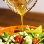 Fig Vinaigrette pouring on a salad