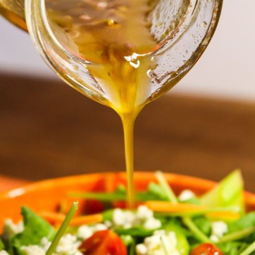 Fig Vinaigrette pouring on a salad