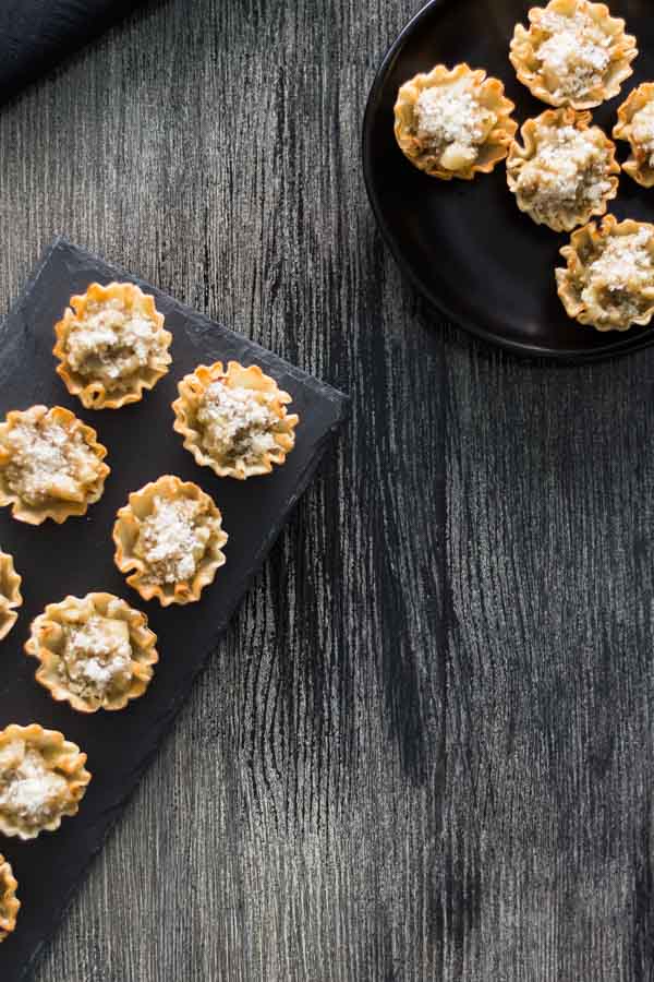 Artichoke Parmesan Bites is our collection of recipes easy 1-2-3. This is a perfect bite with the crunchy shell, Artichoke Parmesan Tapenade, and the melted shared Parmesan. Find this recipe and more party ideas at Spoonabilities.com