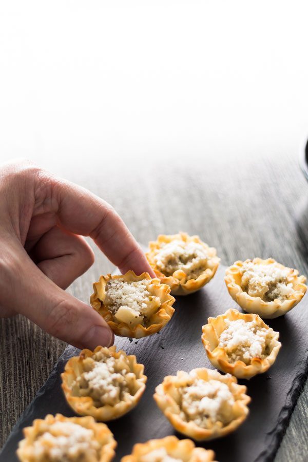 Artichoke Parmesan Bites is our collection of recipes easy 1-2-3. This is a perfect bite with the crunchy shell, Artichoke Parmesan Tapenade, and the melted shared Parmesan. Find this recipe and more party ideas at Spoonabilities.com