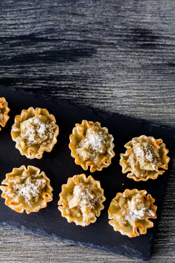 Artichoke Parmesan Bites is our collection of recipes easy 1-2-3. This is a perfect bite with the crunchy shell, Artichoke Parmesan Tapenade, and the melted shared Parmesan. Find this recipe and more party ideas at Spoonabilities.com