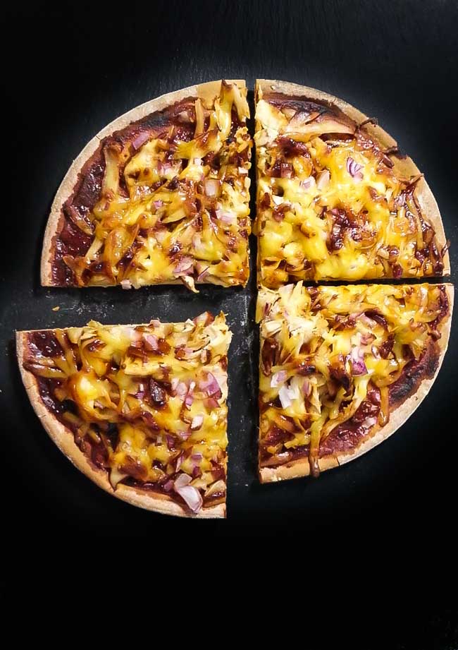 This Easy BBQ Chicken Pizza Recipe was made our Spicy Orange BBQ Sauce. The Pizza is citrus, tangy, spicy and of course with strong BBQ flavor. Find this recipe and the BBQ Sauce at Spoonabilities