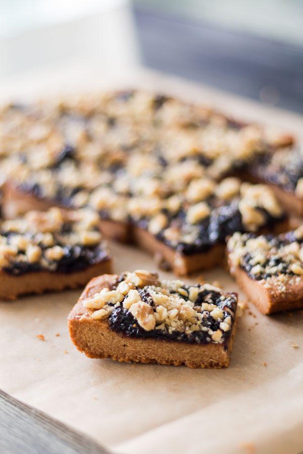 One Peanut Butter Jelly Bar in front of the rest of the bunch. Vegan and Gluten Free recipe. Good source of energy for breakfast or snack. 