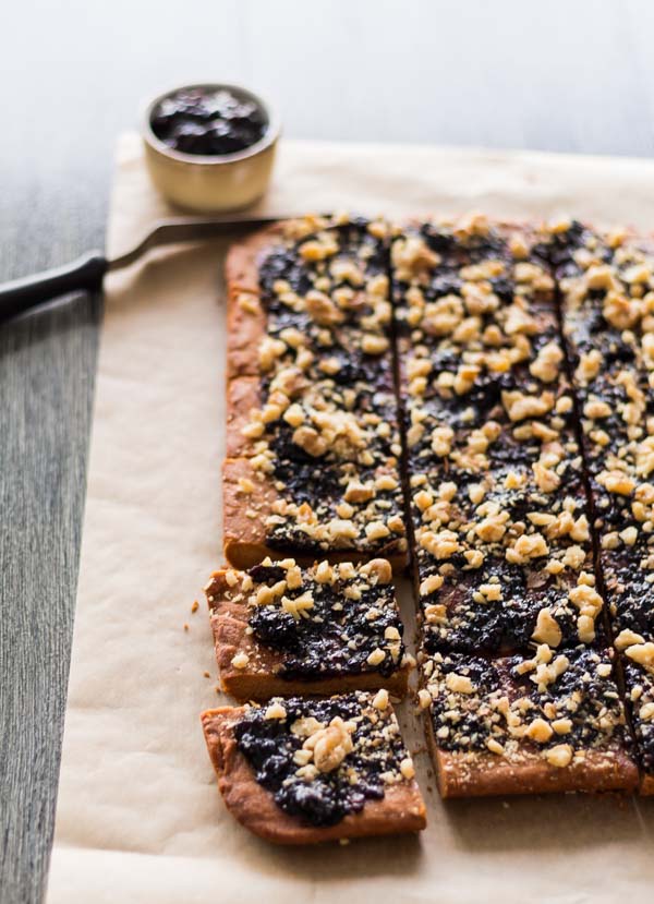 Peanut Butter Jelly Bars cut into squares. Made with L’Epicurien Wild Blackberry Preserve. 