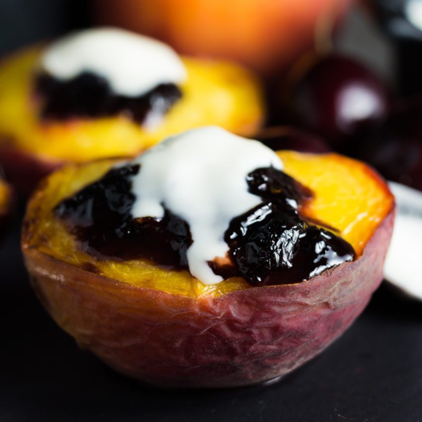 Broiled Peaches with Black Cherry Preserve topped with a creamy Creme Fraiche. You can find this recipe and others fresh and super easy recipes at Spoonabilities.com