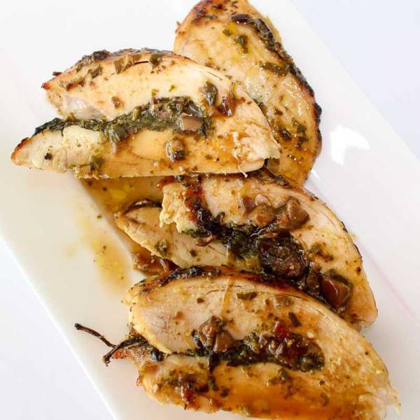 Stuffed Chicken with Sun Dried Tomato, Basil Pesto, Black Olive & Feta. The name is long, but the recipe is very easy. Done in under 45 minutes. Impress your friends with this gourmet dinner. They will think you spent all day in the kitchen! Spoonabilities.com