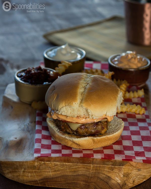 Spicy hamburger on wood board