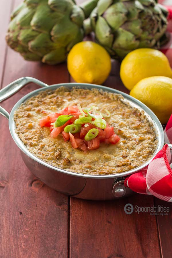 Asiago Crab Artichoke Dip is an easy recipe appetizer made under 30 minutes. I love this kind of recipe that I just have to open a couple of jars and through everything in a bowl, mix, bake and serve. Spoonabilities.com