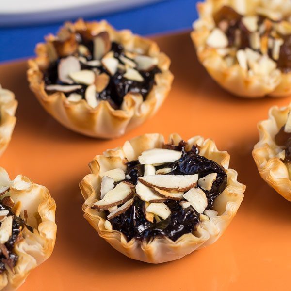 Fig Almond Tartlets Appetizer Recipe is one of our easy party bites recipes. This appetizer can be whipped up in under 30 minutes. This appetizer has the flavors from the holiday season with our Fig Almond Spread. Spoonabilities.com