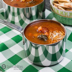 Pot of Hearty Vegetable Soup on a green and white checkered tablecloth