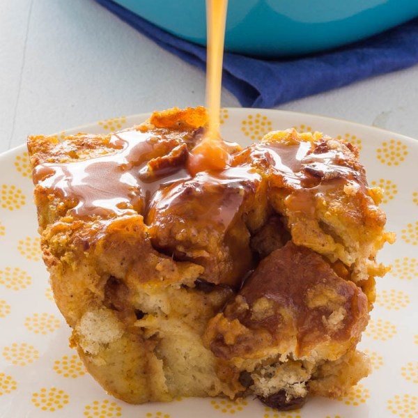 L’Epicurien Salted Butter Caramel Spread pouring down on piece of Pumpkin Bread Pudding