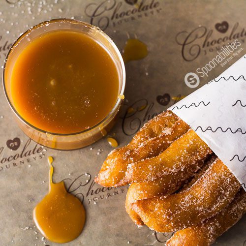 Churros dipped in Salted Caramel Sauce. Our favorite dipping sauce is Salted Caramel Sauce available at Spoonabilities.com