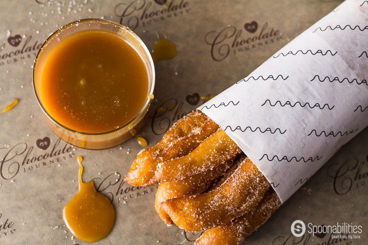 Churros dipped in Salted Caramel Sauce from Coop's is one way to eat the crispy & sugary Spanish snack. Hot Spanish churros are traditionally eaten for breakfast. Spoonabilities.com