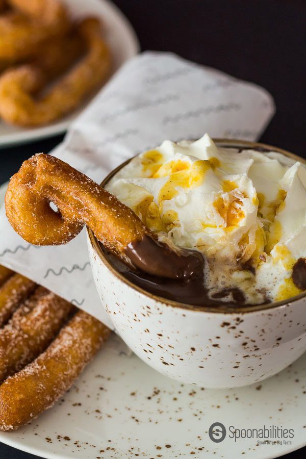 Authentic Spanish Hot Chocolate recipe with whipped cream and churros