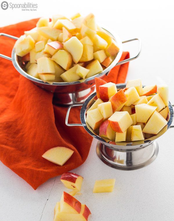 Sliced pieces of Gala apples in metal bowls that are about to be simmered in Caramel Sauce