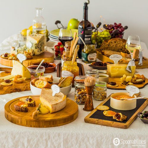 Wine and Cheese Tasting Party with L’Epicurien Apricot Preserve, Black Olive Tapenade. Cheese and jam pairing in beautiful rustic wooden boards. Spoonabilities.com