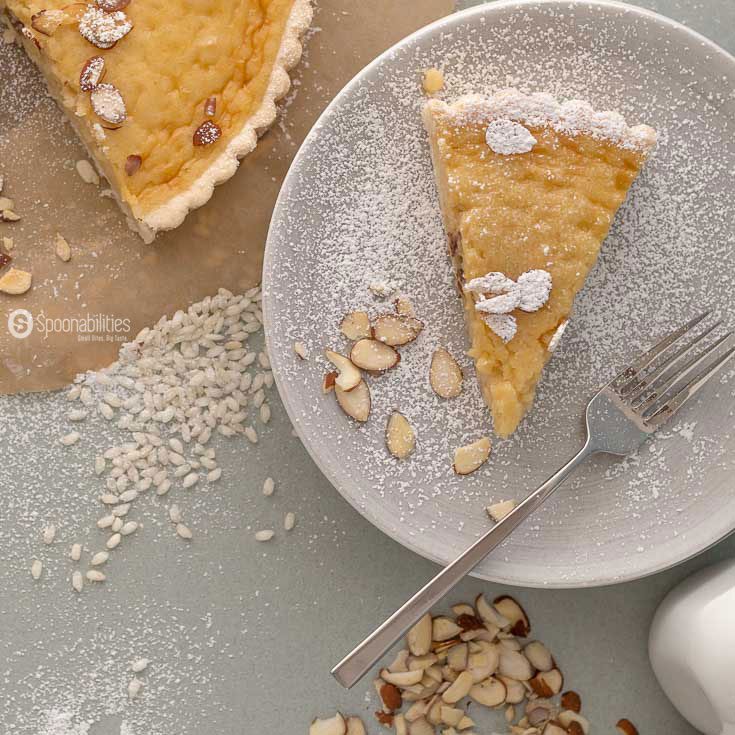 The Traditional Swiss Easter Rice Tart Recipe is a crunchy sweet tart filled with a custard type filling of rice pudding, lemon, and ground almond. Spoonabilities.com