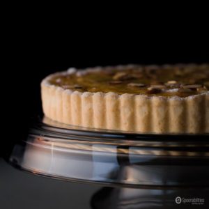 Traditional Swiss Easter Rice Tart Recipe is a custard dessert in a sweet pastry crust tart. Made with rice, lemon, almonds, and special personal touches like evaporate milk, amaretto liquor & raisins. Spoonabilities.com