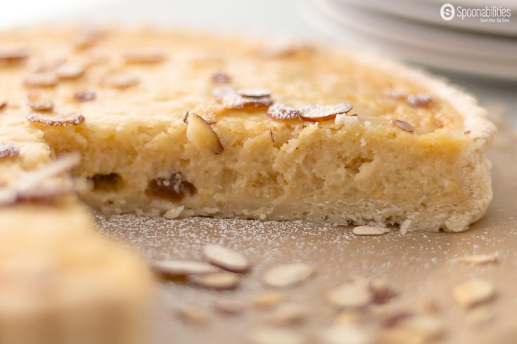 The Traditional Swiss Easter Rice Tart is a dessert recipe made in Switzerland during Easter with rice pudding, lemon, raisin, ground almond, and we added amaretto liquor. Spoonabilities.com