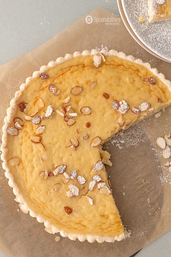 Traditional Swiss Easter Rice Tart Recipe is a crunchy sweet tart filled with a custard type filling of rice pudding, lemon, and ground almond. Spoonabilities.com