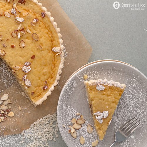 Traditional Swiss Easter Rice Tart Recipe: custard type filling with rice pudding, citrusy lemon, ground almond and crunchy sweet tart. Made in Switzerland only during Easter. Spoonabilities.com