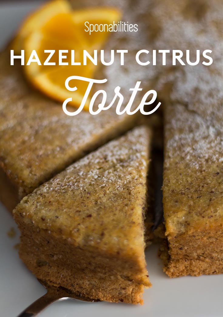 Slice of Hazelnut Citrus Torte being lifted out. Jewish dessert recipe served at Passover. Spoonabilities.