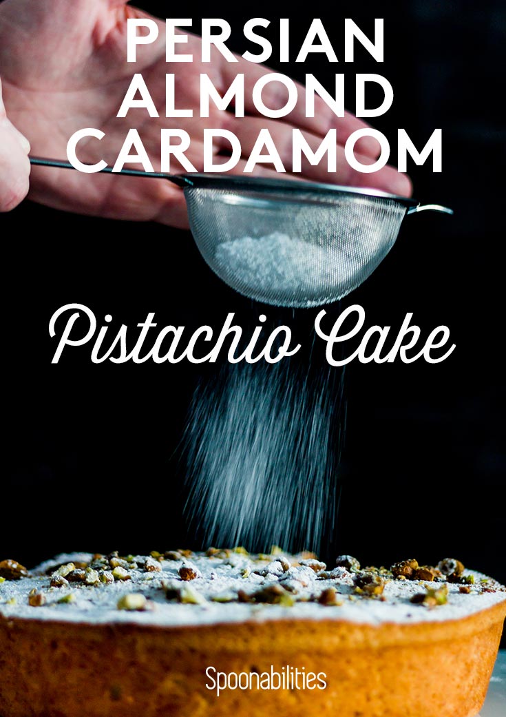 Sprinkling powdered sugar on top of Persian Almond Cardamom Pistachio Cake. Spoonabilities.com