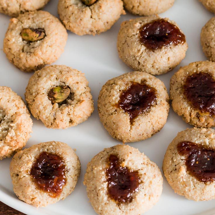 closeup place of Walnut Macaroon Thumbprint Cookies