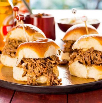 Juicy Pulled Pork Slider with Salted Caramel Sauce. This small bite is perfect for serving at parties or as an appetizer. L’Epicurien Salted Butter Caramel Spread available at Spoonabilities.com