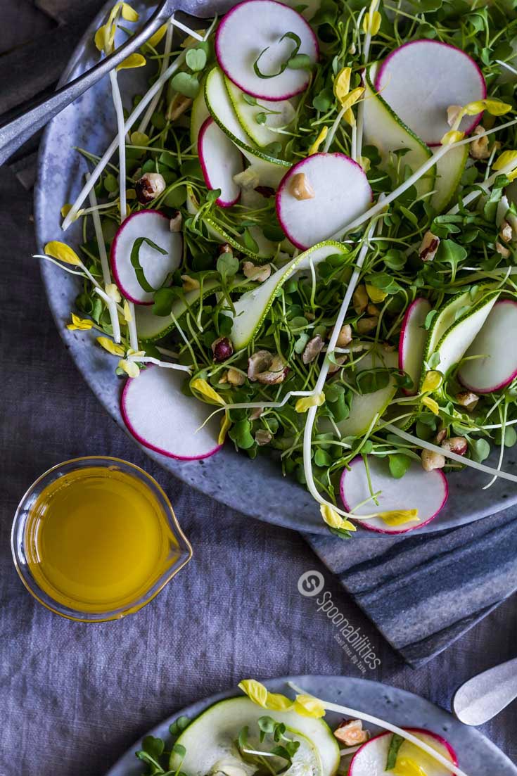 Fresh Yellow Pea Shoot Salad Recipe with Champagne Mustard Vinaigrette has a tender texture with fresh spring pea taste and a peppery, nutty, mustardy undertone. Spoonabilities.com