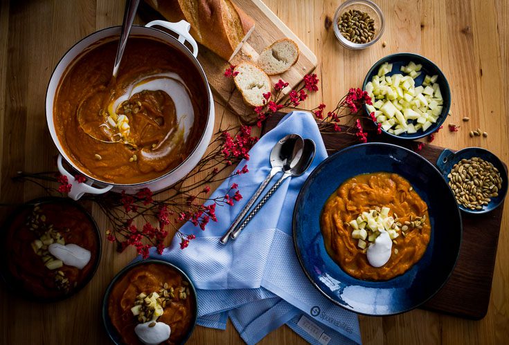 Roasted Pumpkin Bisque is cooked with apple juice, sautéed leeks, vegetable stock and vanilla. This fall soup recipe is perfect for Thanksgiving dinner. Spoonabilities.com