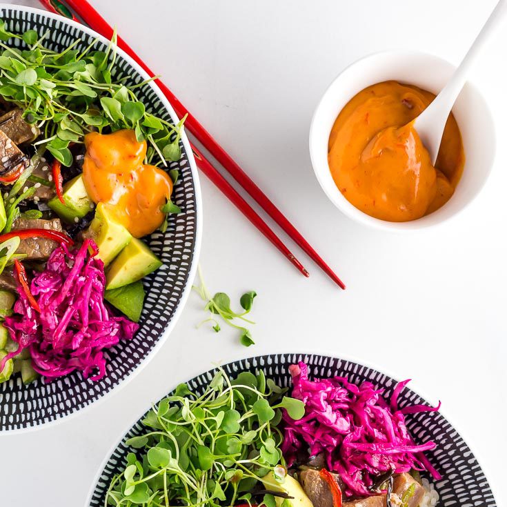 small bowl of Sriracha Mayonnaise next to two Spicy Tuna Poke Bowls