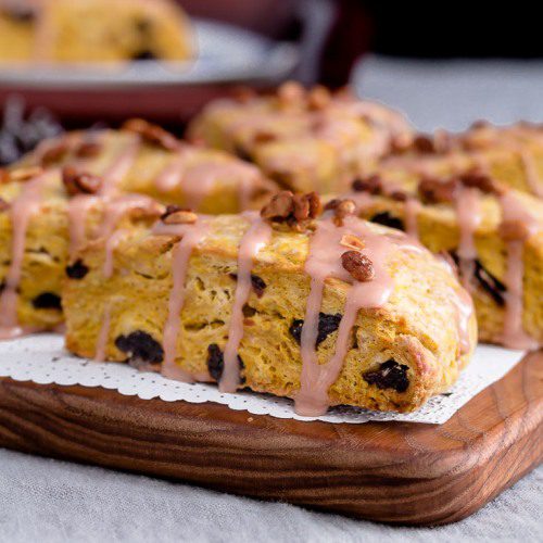 Cherry Pumpkin Scones are Fall inspired with blood orange & maple syrup glaze, garnished with maple roasted pumpkin seeds. Spoonabilities.com
