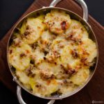 Close up of baking dish full of Leek & Potato Gratin