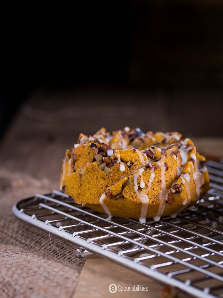 Pumpkin Pecan Cakes with the citrusy orange glaze have the fall flavors of pumpkin puree and all year round appeal from the favorite toasted pecans. Spoonabilities.com