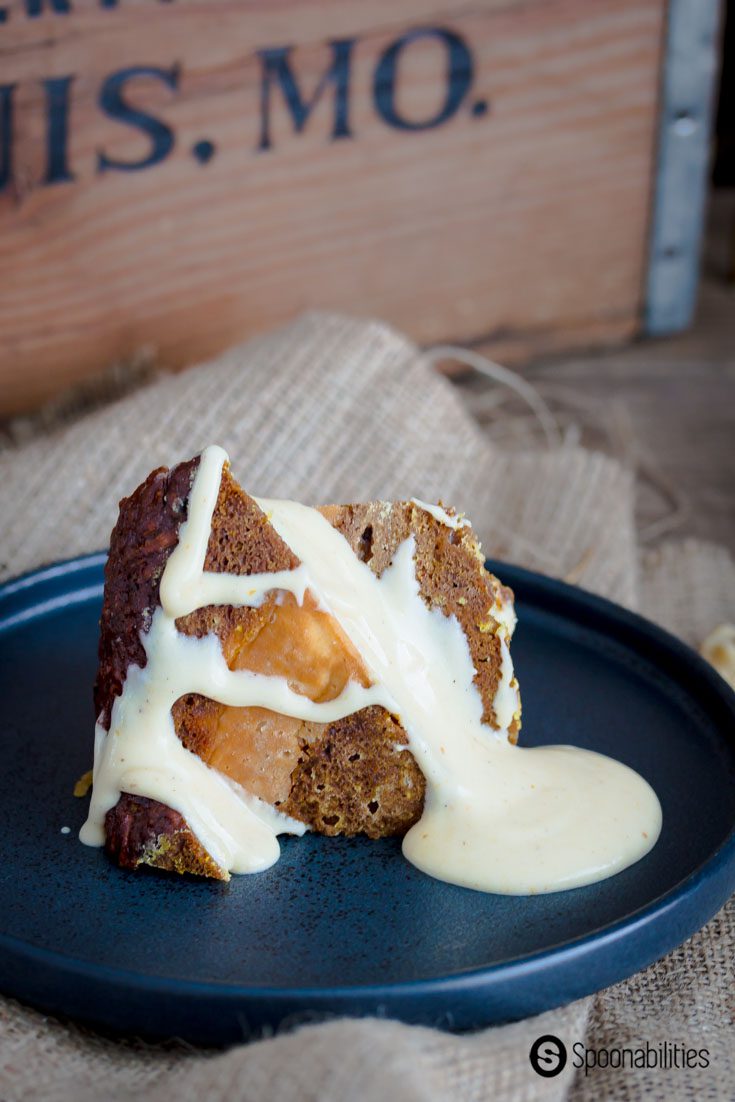 Slice of Pumpkin Carrot Bundt Cake with extra vanilla maple syrup drizzle.