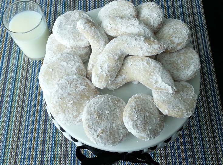 Almond Thumbprint Cookies filled with Triple Berry Jam. Almond Thumbprint Cookies are the flavor of traditional Christmas Almond Crescents cookies that everyone loves. #Christmas #ChristmasCookies #Cookies Spoonabilities.com