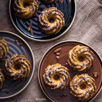 a photo of Mini Pumpkin Pecan Cakes Orange Glaze in plates