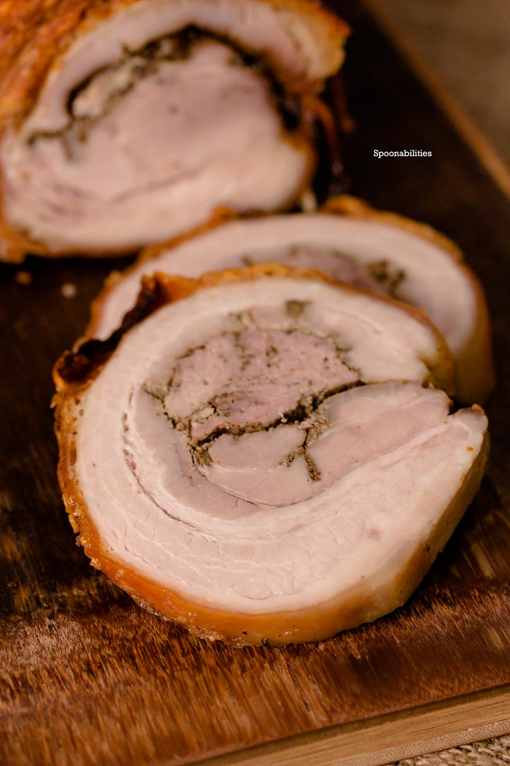 Pork Porchetta is an Italian recipe using pork belly seasoned with fennel, garlic, pepper & other herbs. Moist roasted meat with a crispy skin. Spoonabilities.com