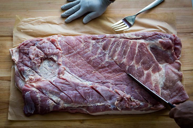 Pork Porchetta is an Italian recipe using pork belly. Here I'm cutting long incisions like diamond shapes. Spoonabilities.com