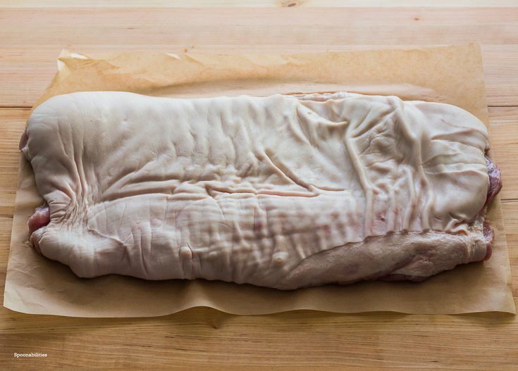 Full size pork belly from the butcher ready to make Pork Porchetta. Spoonabilities.com