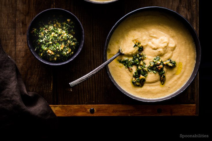 Creamy Celery Root Soup recipe is easy to make and flavorful. This soup has celery root, leek, parmesan & Walnut-Parsley Gremolata. Spoonabilities.com