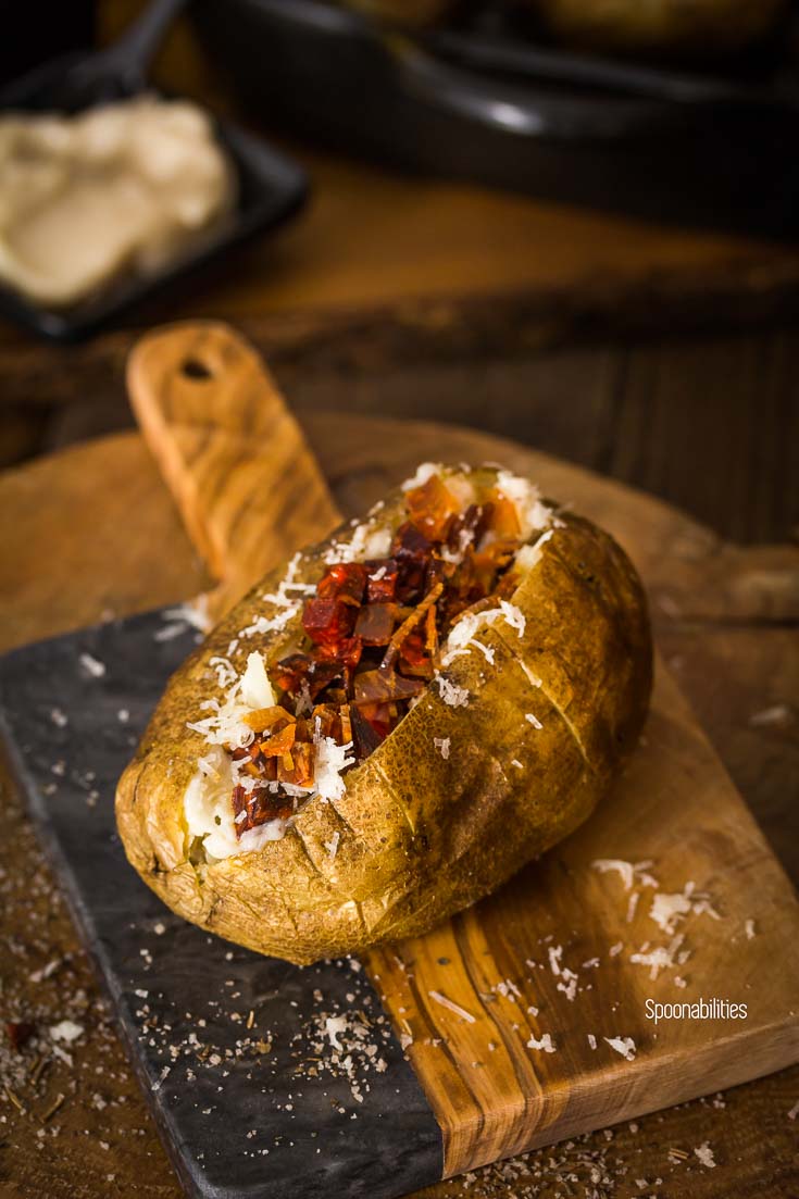 Spanish style double baked potato is perfectly baked with a crispy skin and fluffy interior. Spoonabilities.com