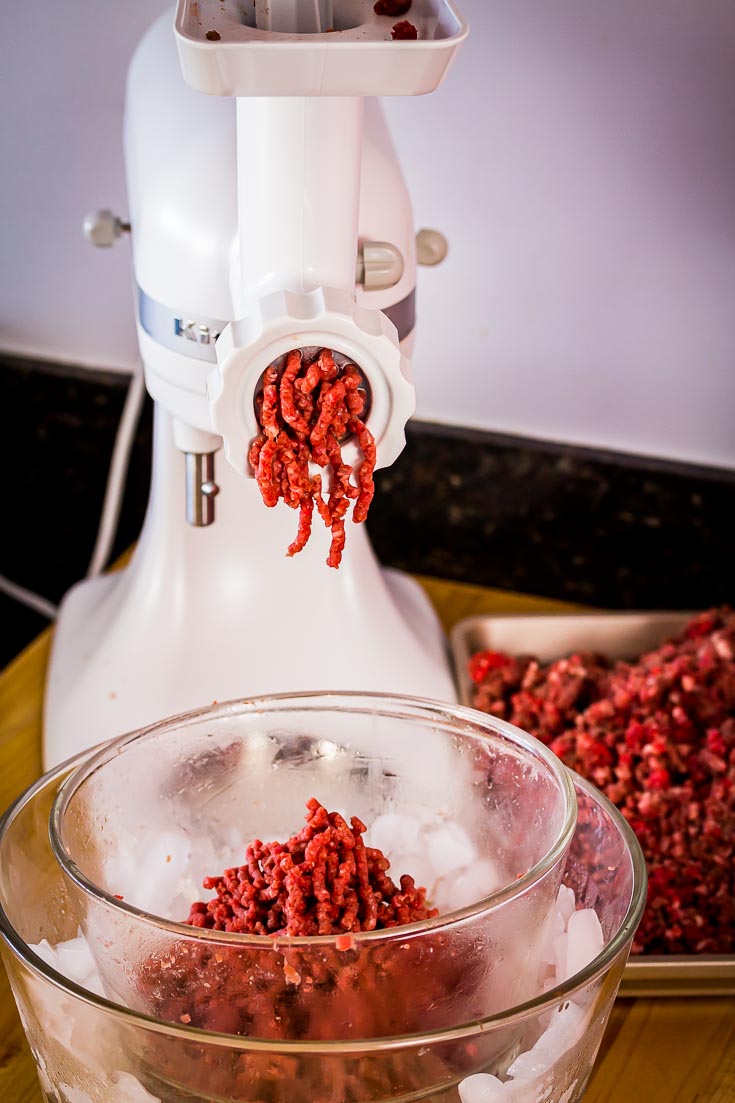 Passing the ground beef again through the grinder with a fine plate. Spoonabilities.com