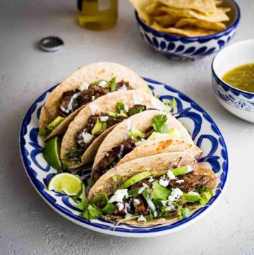 Tender grilled Skirt Steak Tacos that have been marinated in jalapeño, lime, cilantro, garlic, cumin, and olive oil. Spoonabilities.com