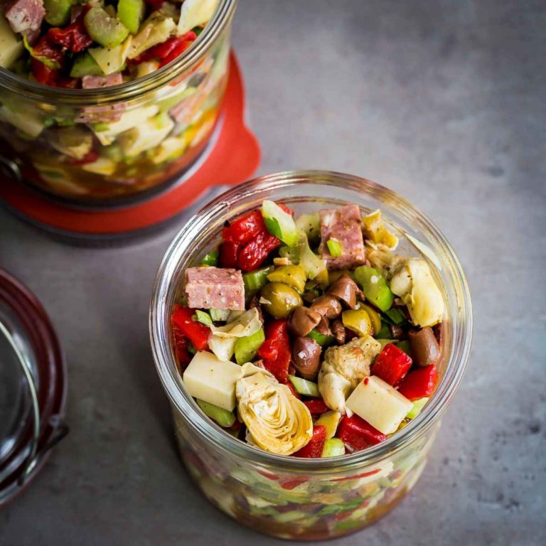 Antipasto Salad in a Jar with provolone, hard salami, olives, roasted red pepper, artichokes, Italian vinaigrette.