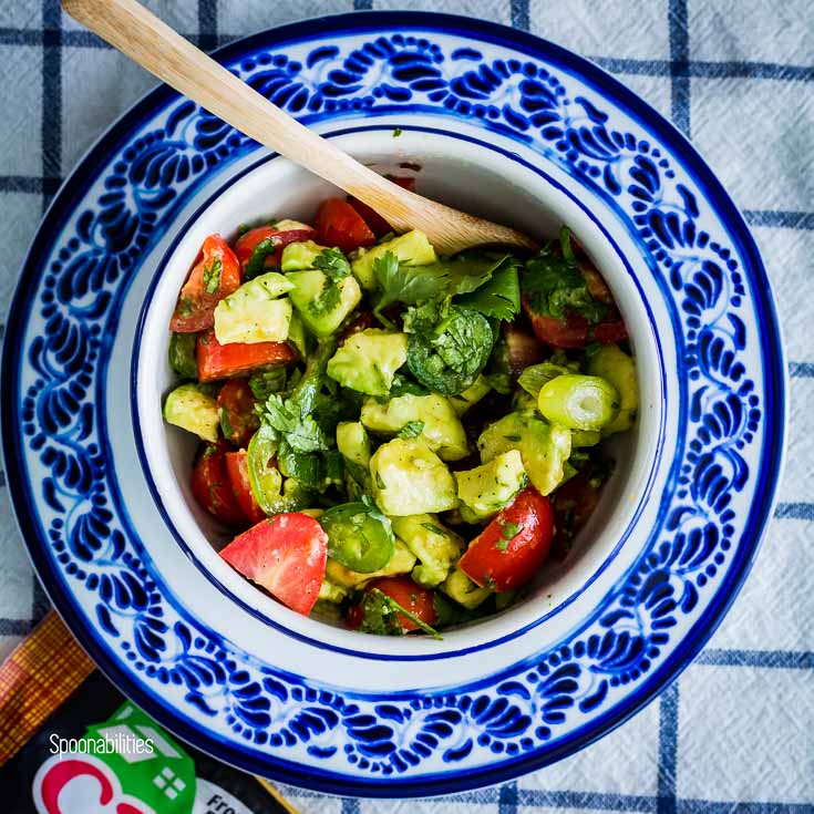 Cherry Tomato Avocado Salsa in a small blue & white round bowl. Spoonabilities.com