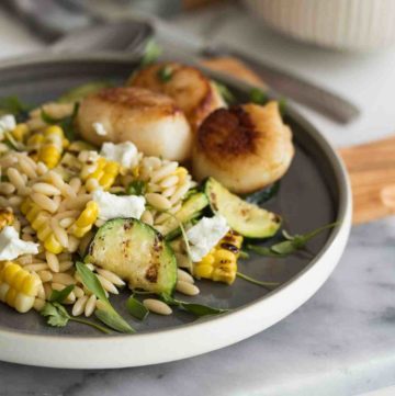 Grilled Corn Zucchini Orzo Salad with creamy garlic mayonnaise salad dressing. Recipe available at Spoonabilities.com