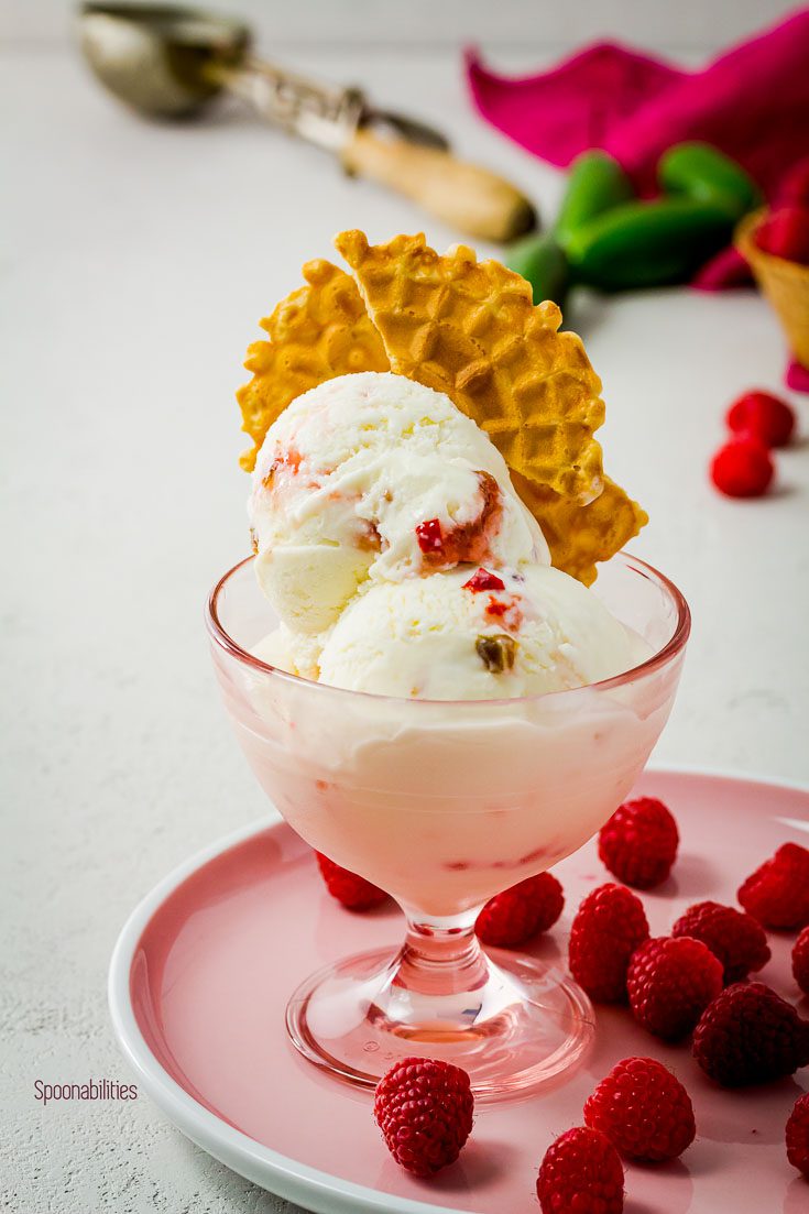 An ice cream bowl with Homemade Goat cheese ice cream with Raspberry Jalapeno preserves by pepperlane and available at Spoonabilities.com