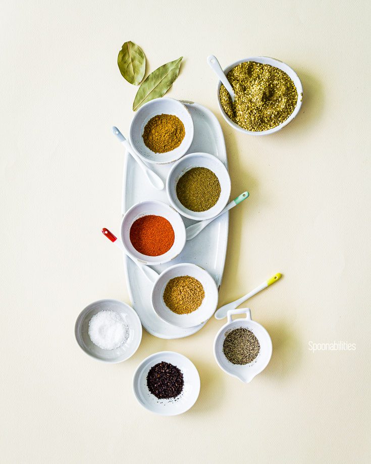 Nine small bowl with Mediterranean spices likeZa’atar, smoked paprika, ground coriander, cumin, sumac, and Greek sea salt & pepper. Spoonabilities.com